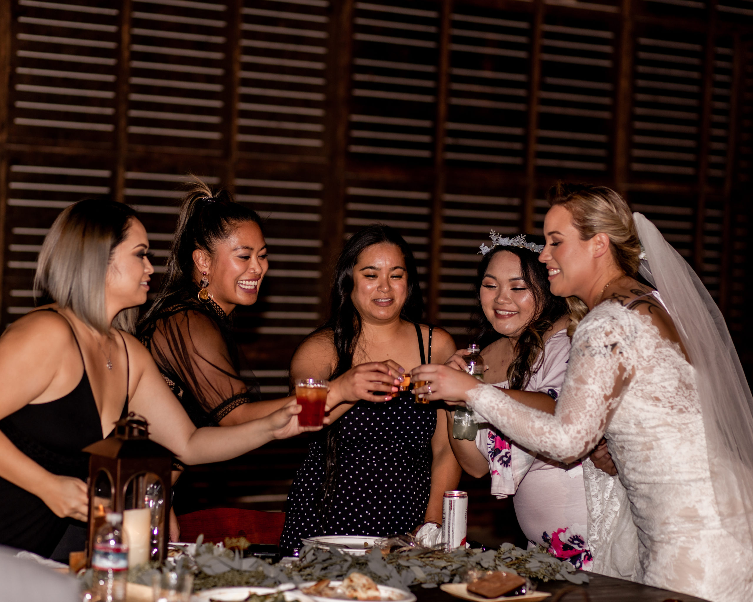 Bride and friends partying at wedding reception at Historic Oakdale Ranch
