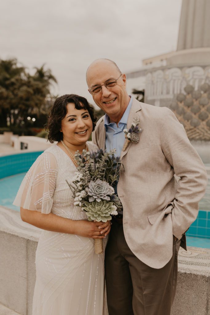 Elopement Couple smiling at Downtown San Diego County Clerk Office
