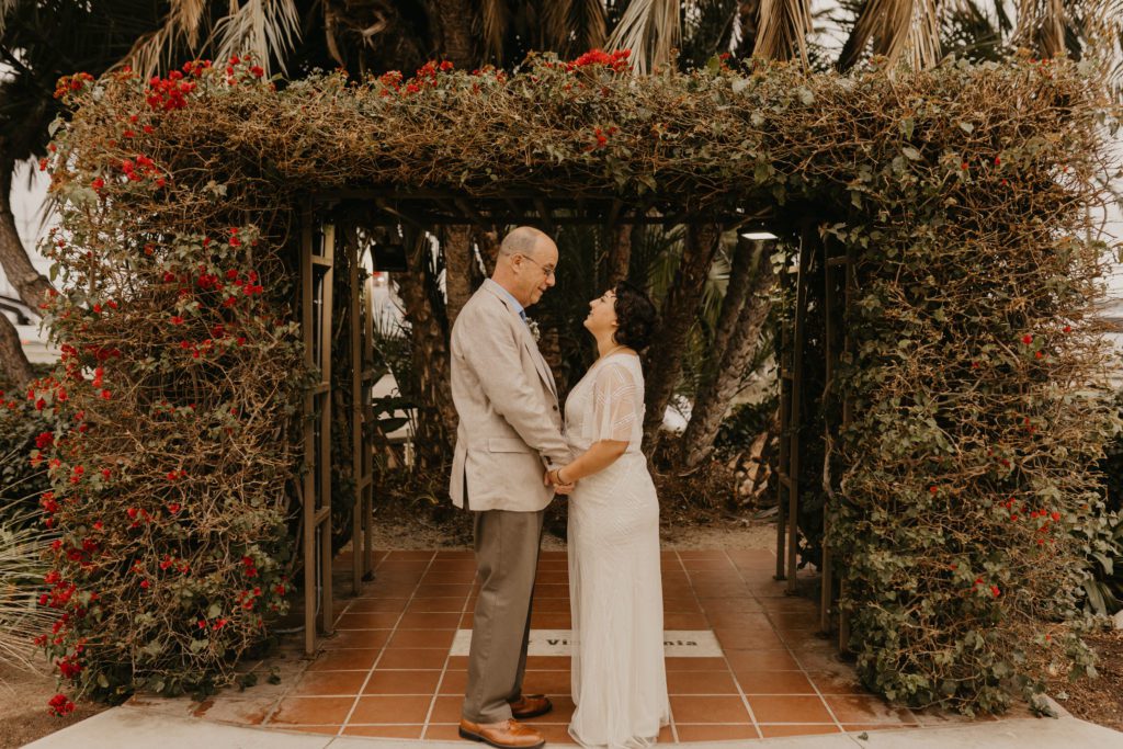Couple standing at the ceremony spot at the Downtown San Diego County Clerk Office.