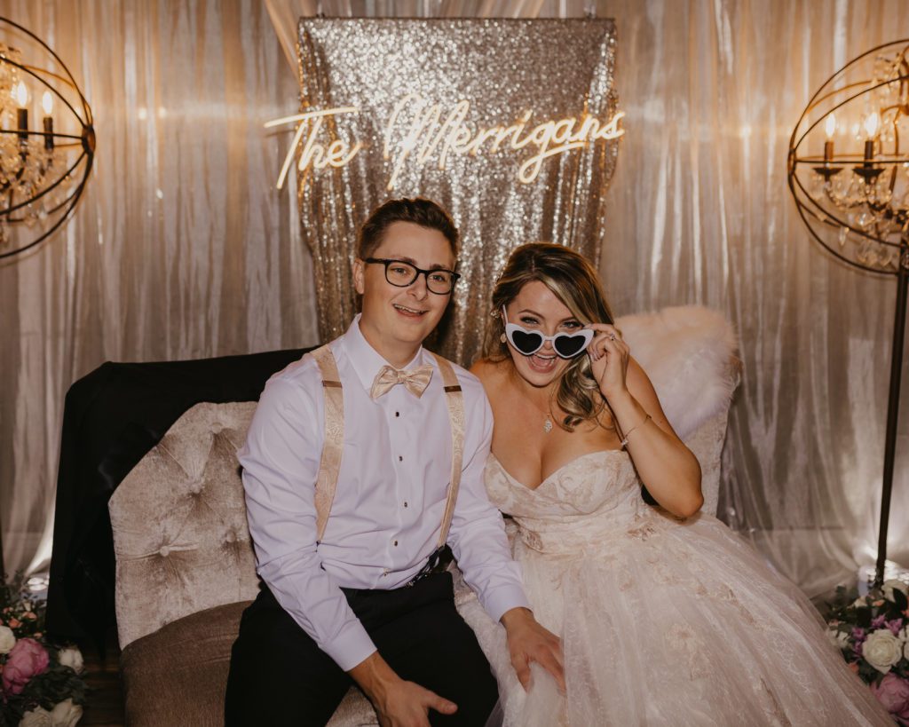 Wedding planning tips! Couple at their sweetheart table during wedding reception.