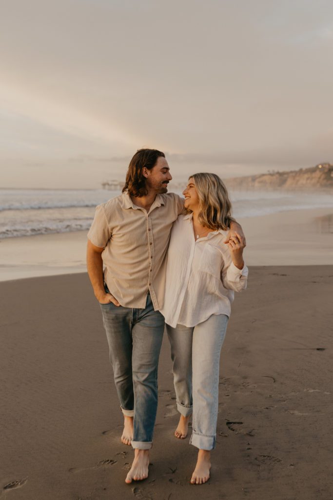 couple walking along La Jolla beach