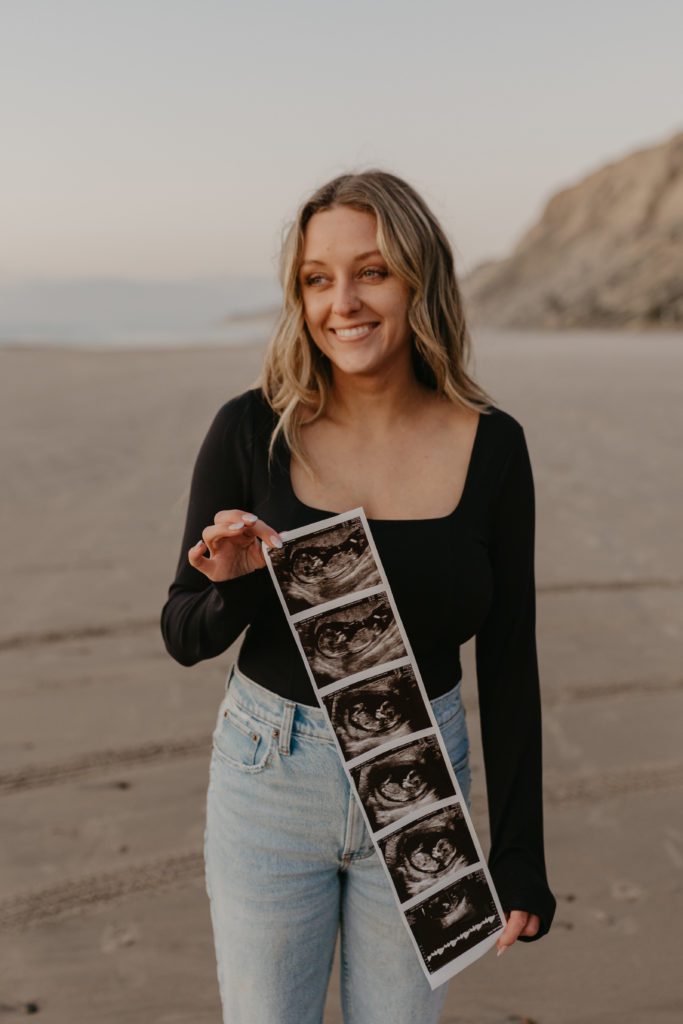 mom holding an ultrasound for a pregnancy announcement